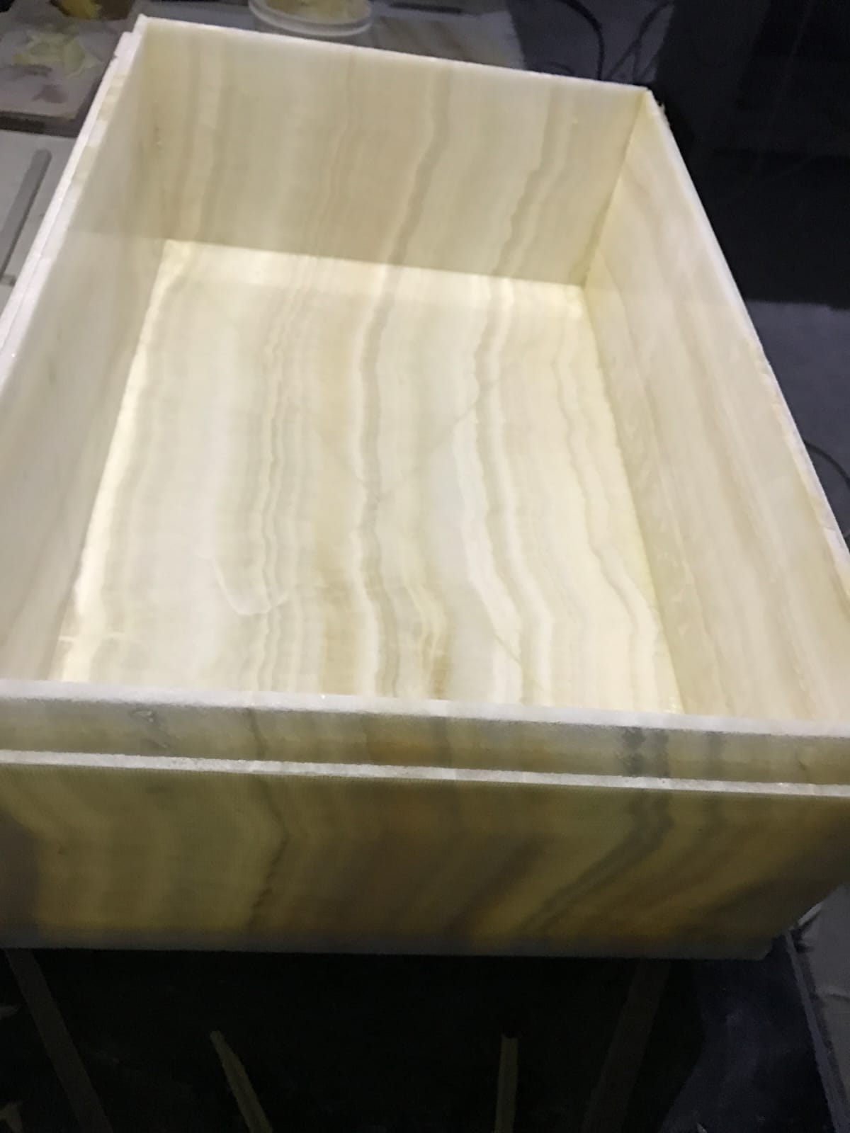 Honey onyx fabricated into a seamless box form with translucent veining